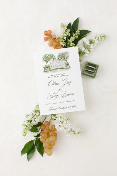 Pink envelopes with a details card, invitation card, rsvp card and envelope, wax seal, and velvet ribbon.