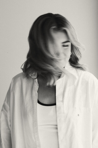 Sunshine Coast photographer captures woman playfully shaking her hair for Branding shoot