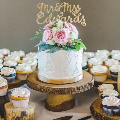 Whippt Desserts rustic woodcutting cake and cupcake display
