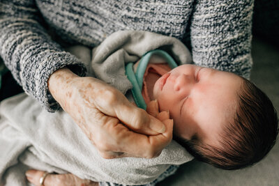 Newborn photographer capturing a newborn baby sleeping.