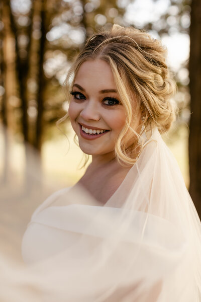 Wedding Photographer, Bride smiling in her dress