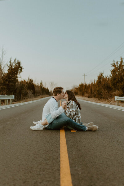 couple sitting in the road
