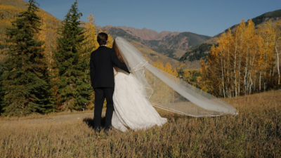 bride and groom holding hands