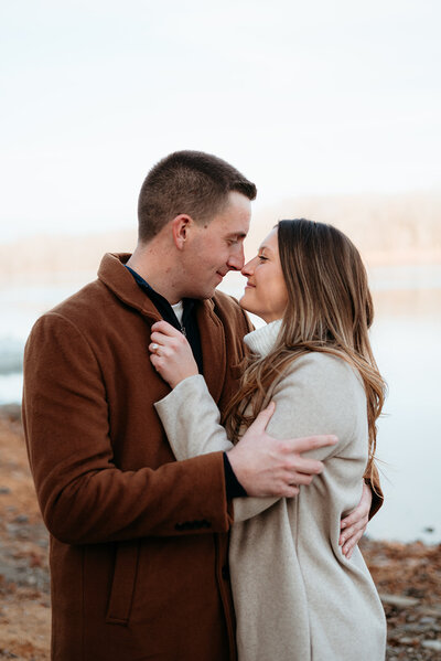 Man proposing to his partner in New Hope, Pennsylvania, during a romantic surprise engagement. A candid documentary-style moment capturing genuine emotions and joy