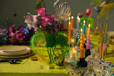 A brightly decorated wedding reception table.