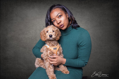"A bride and groom share a joyful lakeside dance during their wedding day, photographed by a Simpsonville photographer in black and white."