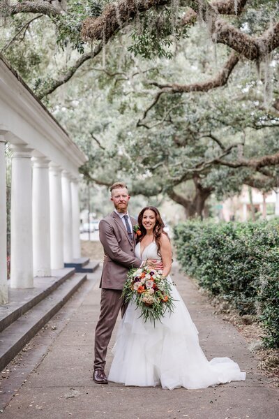 A exquisite portrait of Melissa + Joe after their elopement ceremony at Forsyth Park, "Near The Fountain" in Savannah, captured as part of our Savannah Elopement Package.