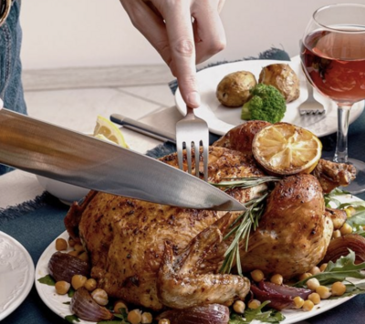 parents holding newborn baby in their home
