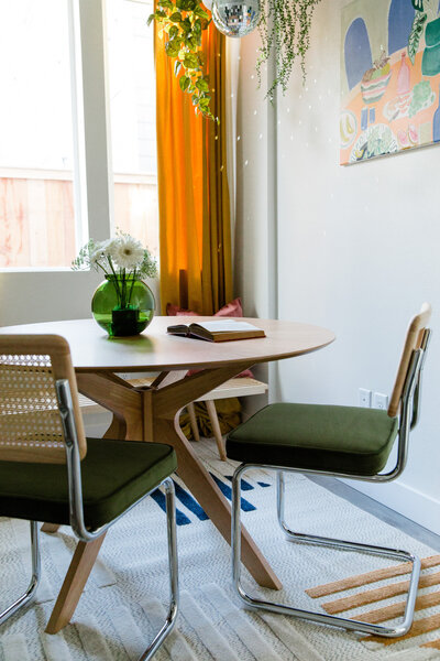 Dining room with green accent chairs
