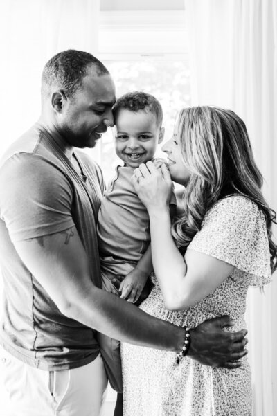 black and white picture of dad, son and pregnant mom