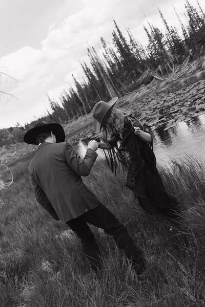 photo of man and woman walking next to a river taken by a Wedding and elopement photographer
