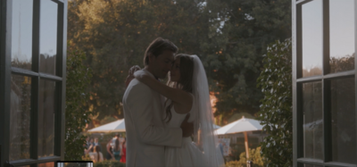 bride and groom smile and embrace