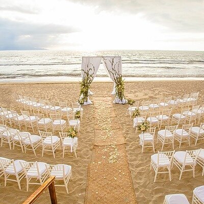 Beach wedding ceremony with florals