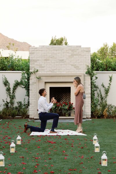 Couple embraces in the desert at sunset for engagement photos