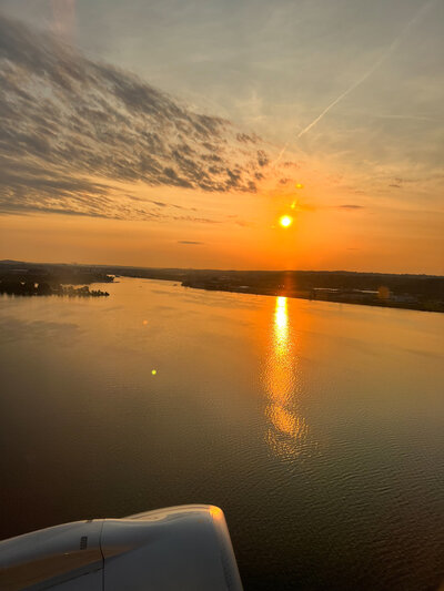 A picturesque sunset over tranquil waters, perfect for a destination wedding planner's romantic setting.