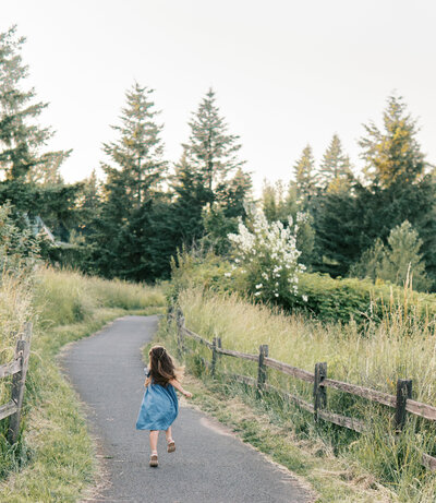 Girl running down path at Powell Butte in Gresham OR
