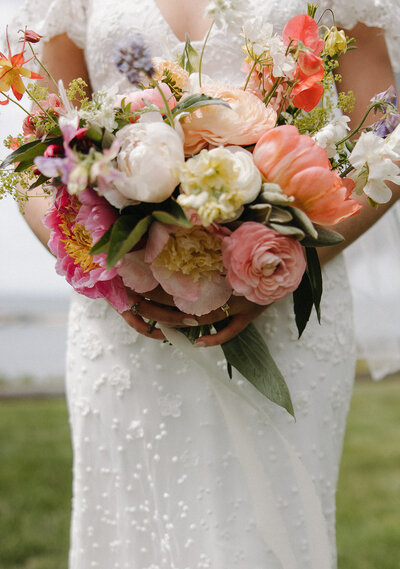 Vibrant wedding bouquet held by a bride in Seattle, designed and coordinated by Wander Event Co. as part of partial planning and design services.