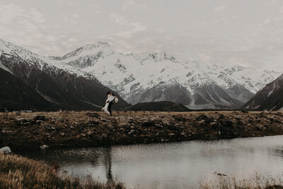 Mt Cook elopement NZ - couple photos with snow covered mountains in the background