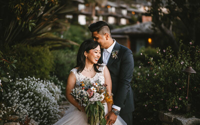 Bride and groom share an intimate embrace at sunset, reflecting the romantic storytelling style we bring to Asheville weddings in the Blue Ridge Mountains.