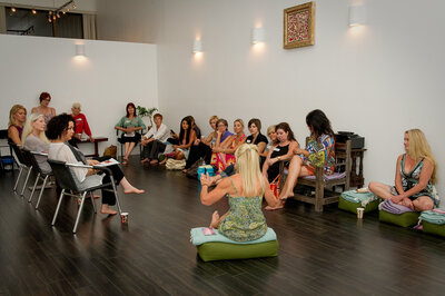 Women-owned business owners having a meeting in a wellness studio.
