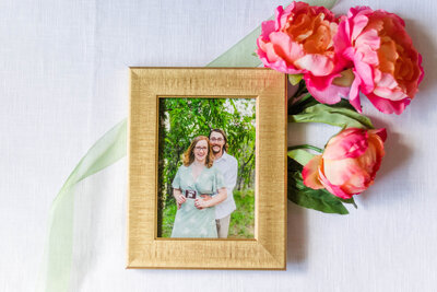 A framed image of a future mom and dad with their ultrasound photo by Laramee Love Photography