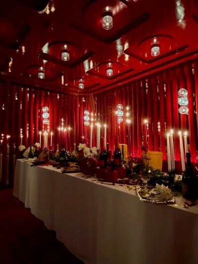red room with cream table and decor 