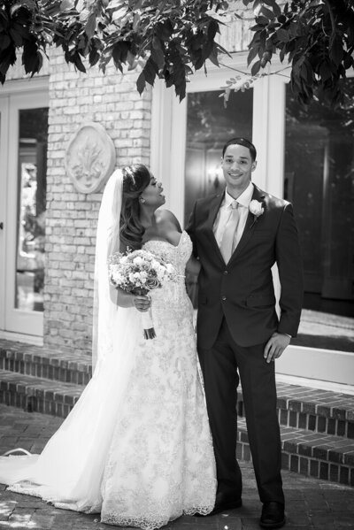 Bride and groom smile during first look