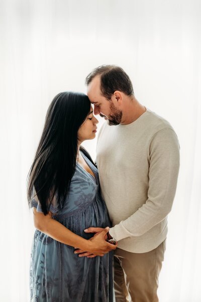 pregnant mom in a walnut creek open space wearing blue maternity gown