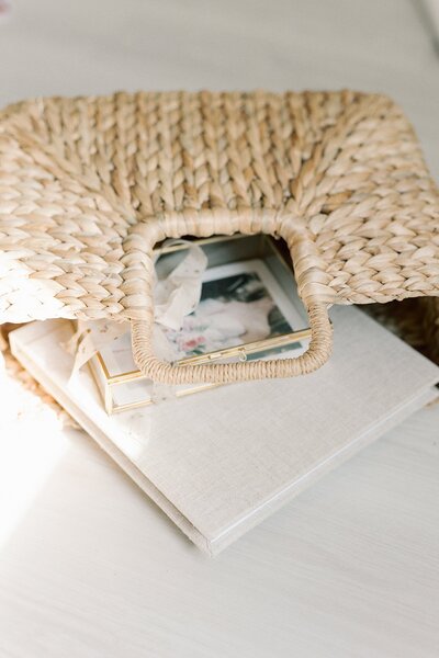 Wicker bag holding Richmond Newborn Photography products