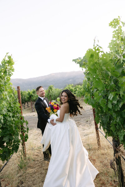 bride and groom kissing at alter