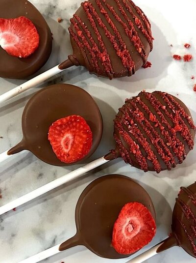 Elegant chocolate-dipped strawberry cakepops from Dip’d Desserts in Portland, Oregon, designed with a luxury finish and crafted for special events and celebrations.