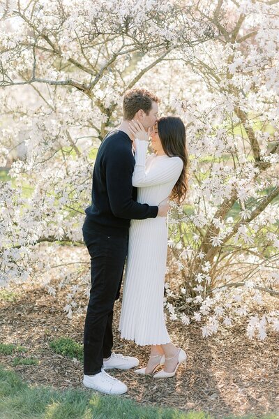 couple in front of flowering tree