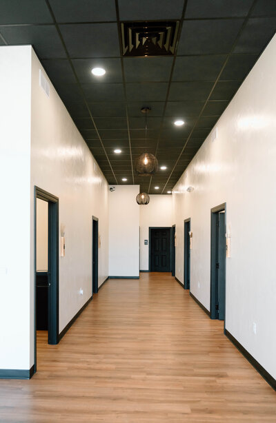Modern hallway at Lavender & Ink Studios with private beauty rooms in New Franken, WI
