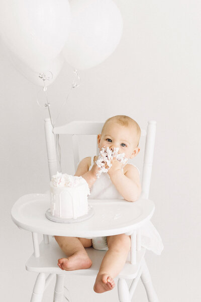 photo of baby with cake taken by newborn photography boston ma​