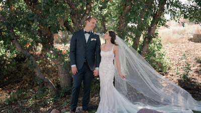 Bride and groom smile at Creekside Event Center