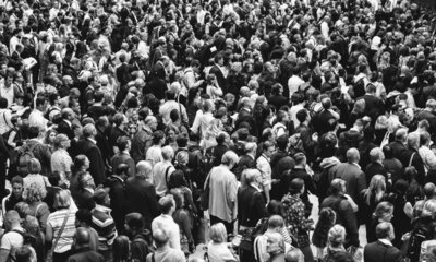A black and white image of a crowed