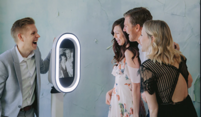 guests posing for the selfie pod photo booth, perfect for private events or events, big or small