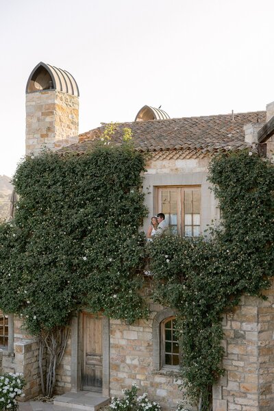 Bride and groom pose together at Sunstone Villa on their wedding day in Santa Ynez, California.