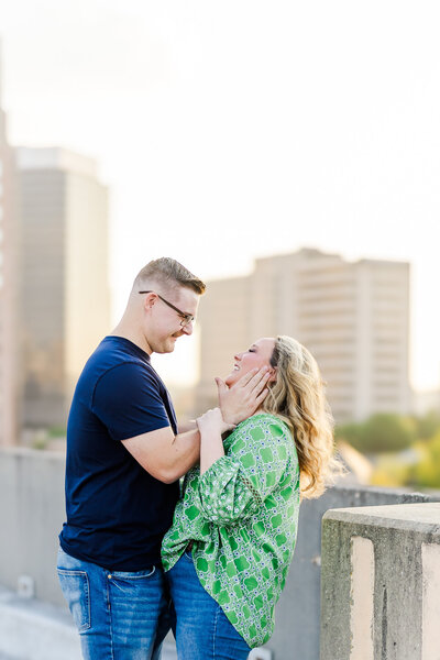 couple standing with foreheads touching
