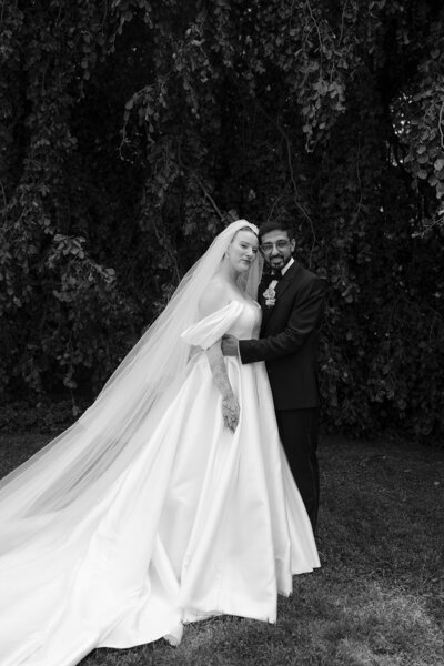 bride and groom under tree
