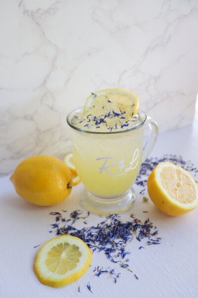 a glass filled with lemonafe