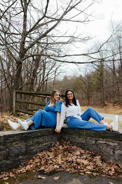 Silhouette of two men kissing with the blue sky and ocean behind them at their Micro Wedding