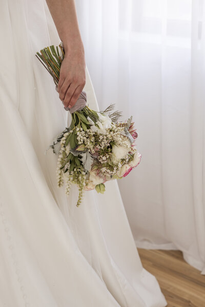 Bride holding flowers during bridal prep photoshoot in Melbourne studio