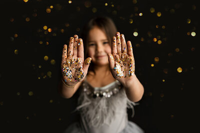 Adorable glitter all over little girl in a gray dress