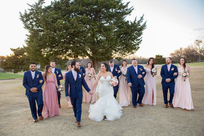 wedding party laughing and walking