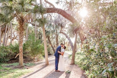 A tranquil elopement at Abercrombie Park on Boca Ciega Bay, with lush greenery, ancient oak trees, and a peaceful natural setting.