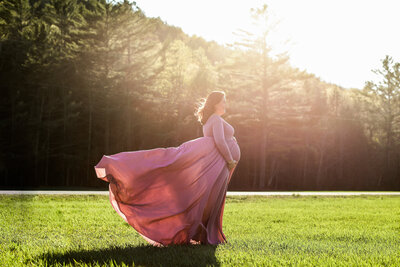 Photo of expecting Mom holding belly in color | Maine Maternity Photographer