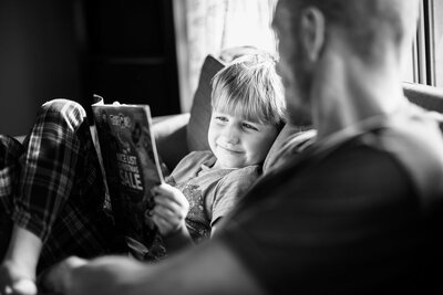 boy reading comic to dad for Orlando Photography Classes