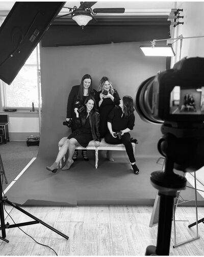photography team poses in studio