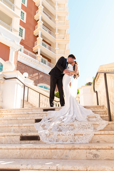 Bride and groom share kiss on wedding day at their Orlando Florida Wedding Venue